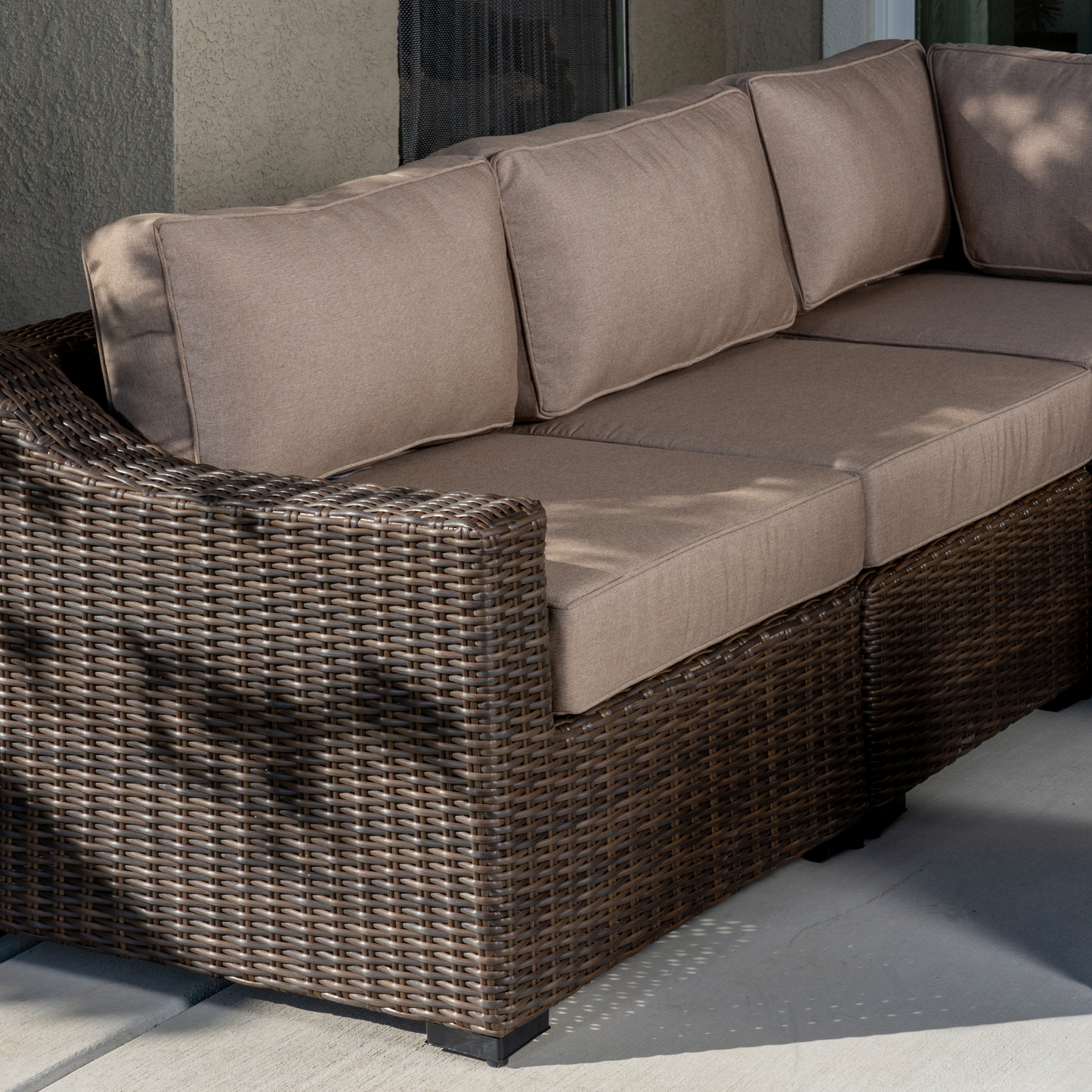 Bristol Wicker 7-Seat Sectional Set with Faux Stone Fire Pit